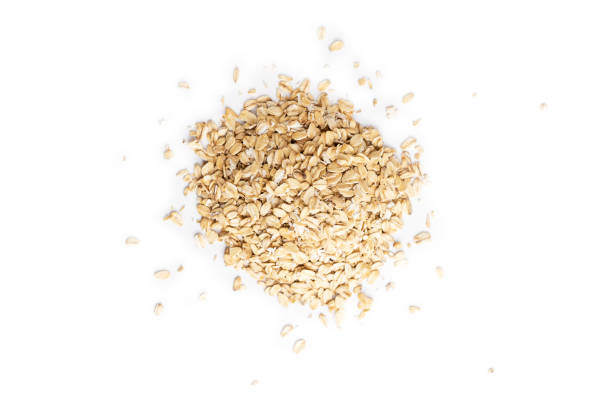 istock A pile of oat flakes isolated on a white background 1273920332