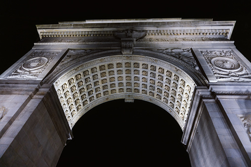 New York, NY / USA - September 19 2020: Close-up of Washington Square Arch at Washington Square Park in New York during the night