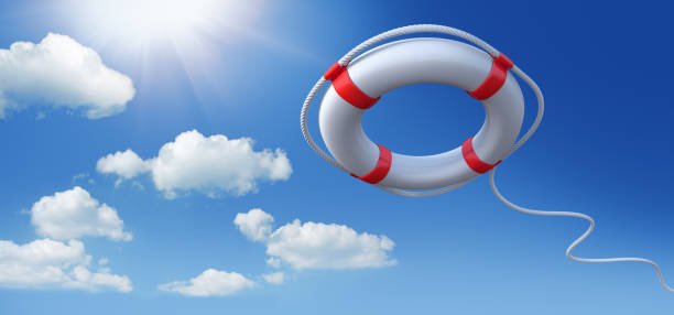istock Red and white life saver with blue sky background 1273929384