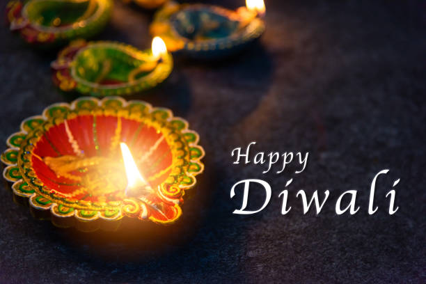 istock clay lit light a fire already on Diya or oil lamp 1273929869