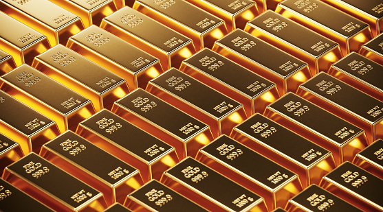 Gold bars laying next to each other. Horizontal composition with copy space. Wealth and finance concept.