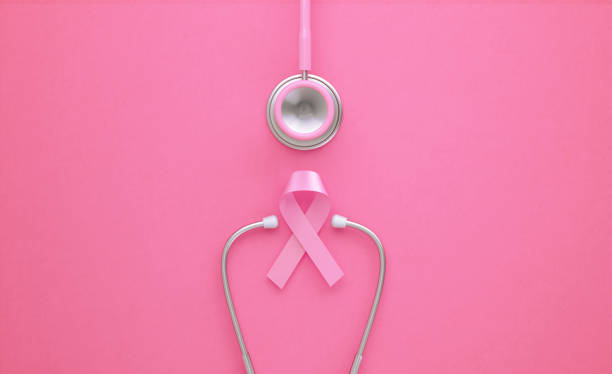 розовый стетоскоп и розовый рака молочной железы осведомленности лента на розовом фоне - рак груди иллюстрации стоковые фото и изображения
