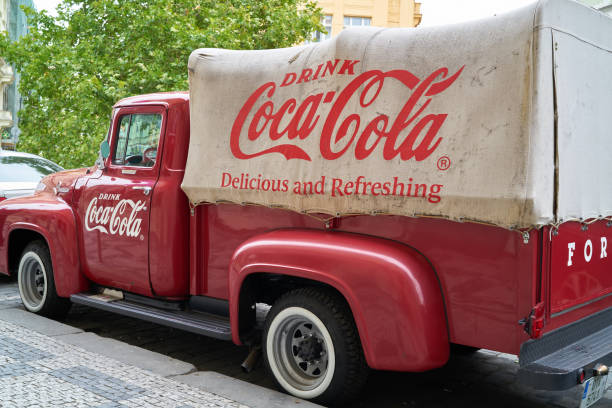 old Coca Cola truck at the roadside in Prague Prague, Czech Republic – October 02, 2019: old Coca Cola truck at the roadside in the old town of Prague cola photos stock pictures, royalty-free photos & images