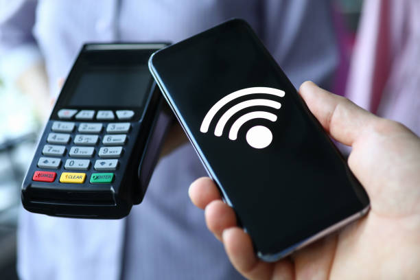 istock People hold portable terminal and smartphone 1273933129