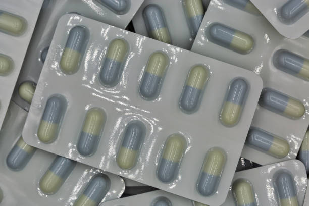 istock Medical capsules in blisters closeup background 1273936040