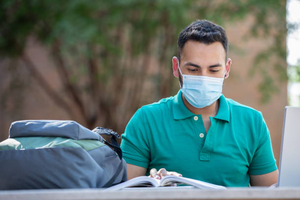istock College student studying outdoors 1273940636