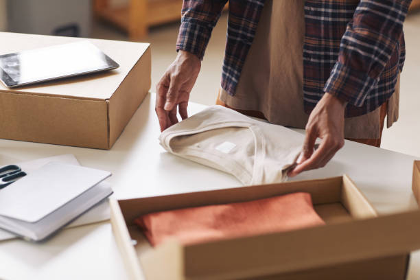 istock Man packing new clothes 1273940760