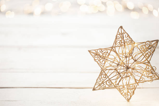 istock Festive new year background with a star and lights 1273972997
