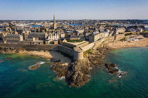 High stone embankment and beach at high tide, in beautiful Saint-Malo, Brittany, France