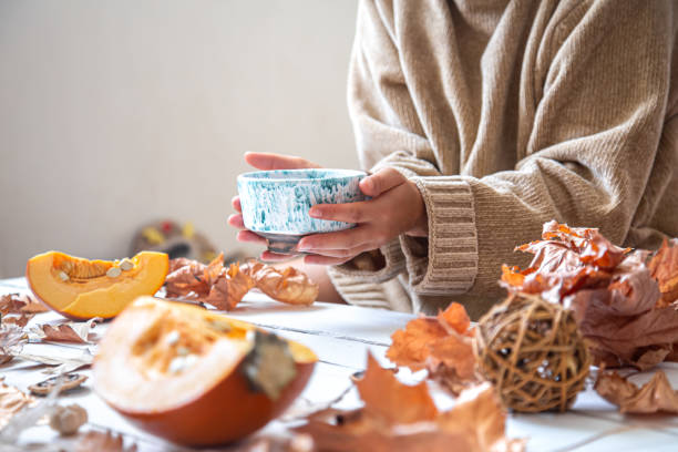 istock Autumn composition with leaves and a Cup of tea on a white background 1273983146