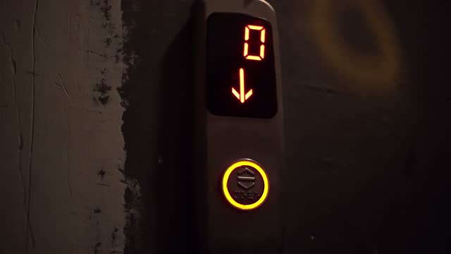 Video recording of a digital counter from ten to zero of a descent of a lith in a building. Modern light, countdown.
