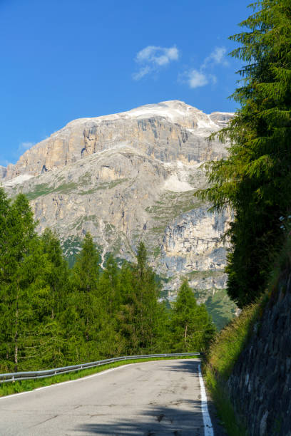 mountain landscape along the road to campolongo pass, dolomites - cordevole valley imagens e fotografias de stock