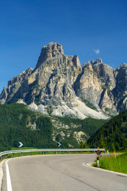 mountain landscape along the road to campolongo pass, dolomites - cordevole valley stock-fotos und bilder