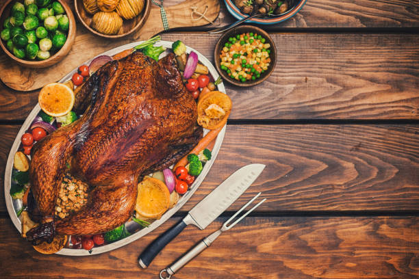 istock Traditional Stuffed Turkey Dinner with Side Dishes for Thanksgiving Celebration 1273999380