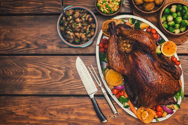 istock Traditional Stuffed Turkey Dinner with Side Dishes for Thanksgiving Celebration 1273999714
