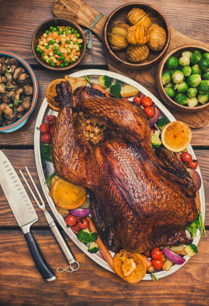 istock Traditional Stuffed Turkey Dinner with Side Dishes for Thanksgiving Celebration 1273999716