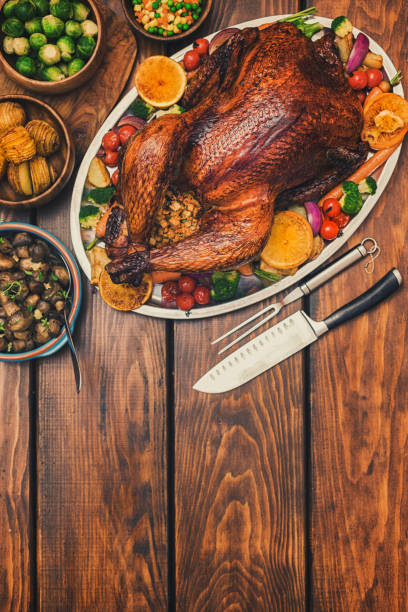 istock Traditional Stuffed Turkey Dinner with Side Dishes for Thanksgiving Celebration 1274000136