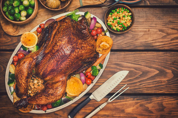 istock Traditional Stuffed Turkey Dinner with Side Dishes for Thanksgiving Celebration 1274000927