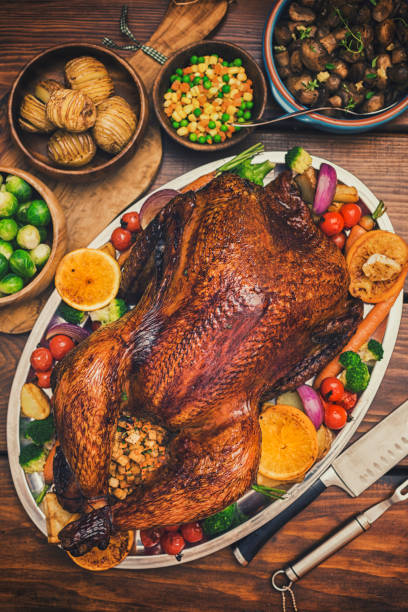 istock Traditional Stuffed Turkey Dinner with Side Dishes for Thanksgiving Celebration 1274002233