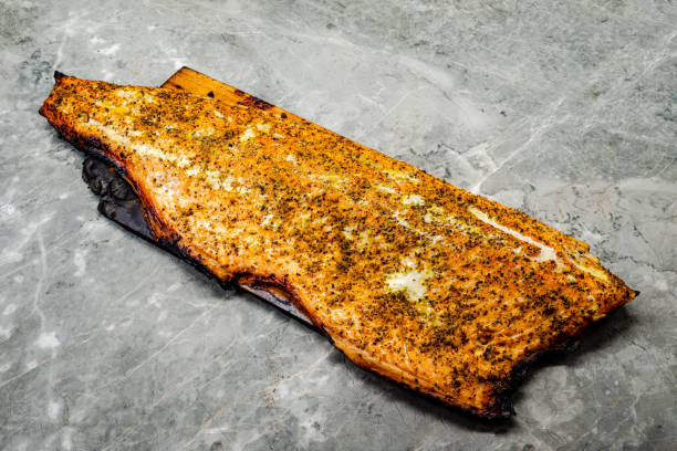 Cedar-Planked Salmon on the BBQ stock photo