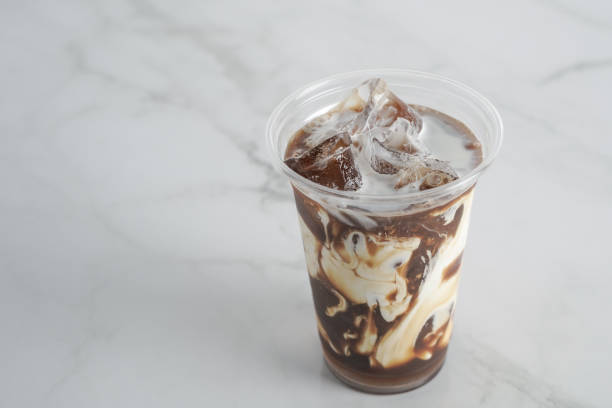 istock Caramel Ice coffee with cream to go, on a marble table, delicious popular drink, texture and refreshing look of the drink, coffee beverage in coffee house.Copy Space. marble background 1274012494
