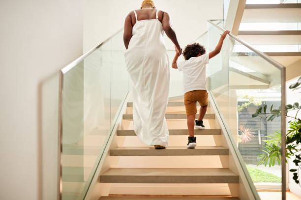 istock Mother and son going upstairs 1274014317
