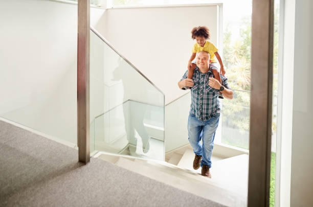 istock Dad carrying his son to his room 1274016899