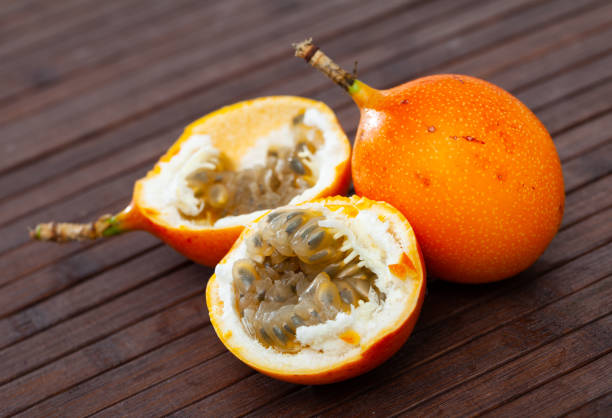 istock Granadilla fruit on wooden table closeup 1274017131