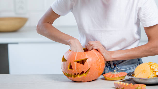 istock Beautiful funny young woman  with pumpkin 1274022341