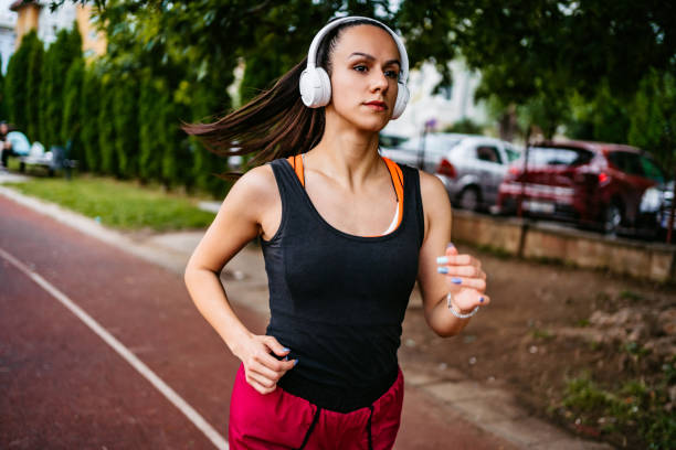 istock Woman running on tracking line 1274044295
