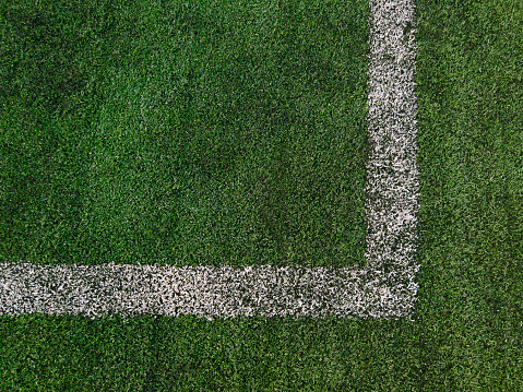 Lawn with white markings for football, playing field. Field for playing football.