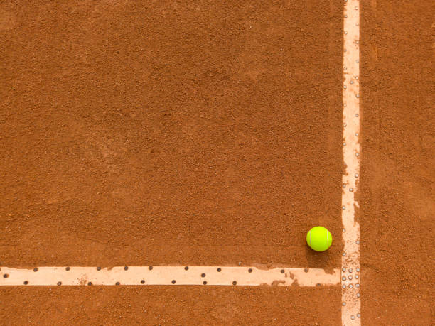 Tennis clay court with a tennis ball Photo taken at a tennis court. Tennis net. clay court stock pictures, royalty-free photos & images