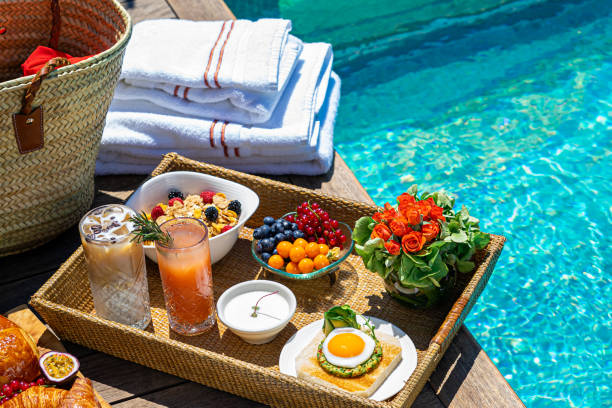 istock tray with assorted breakfast meal and drinks near swimming pool 1274055354