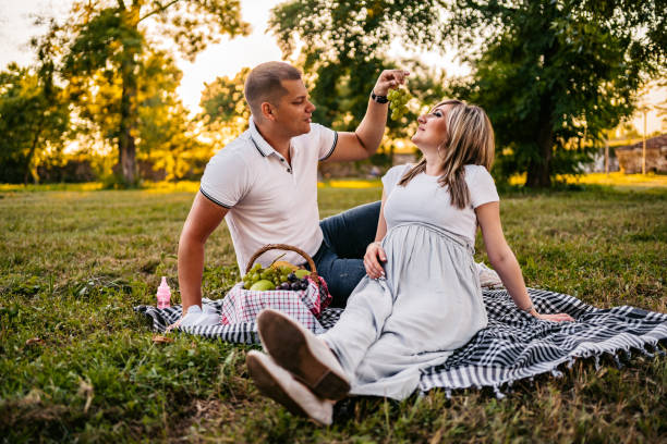 istock Pregnant couple on picnic 1274062821