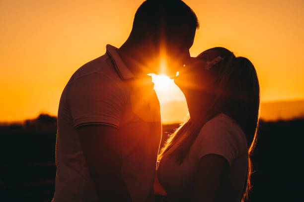 istock Couple kissing at sunset 1274065184
