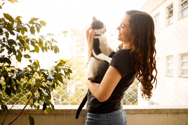 istock young woman with her pet cat 1274065868