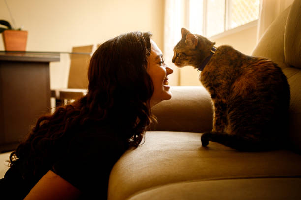 istock young woman with her pet cat 1274066292