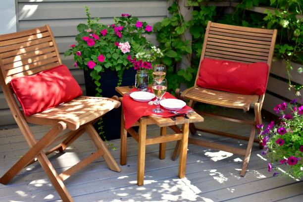 outdoor al fresco dining setting at romantic cozy cafe in beautiful patio setting to enjoy a lovely evening in warm weather - autumn table setting flower imagens e fotografias de stock