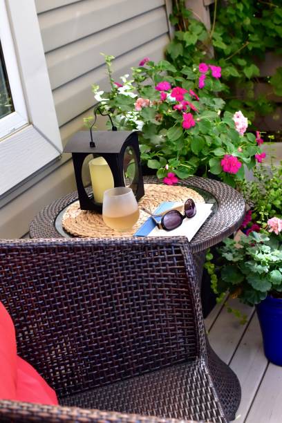 istock Backyard deck with comfortable seating for relaxing and reading with a refreshing glass of wine on warm summer days 1274078686