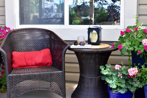 istock Backyard deck with comfortable seating for relaxing and reading with a refreshing glass of wine on warm summer days 1274079291