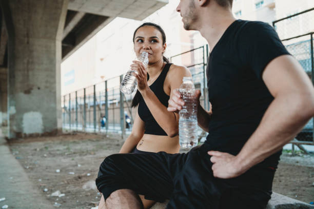 istock Young couple resting together during a session of training 1274090278