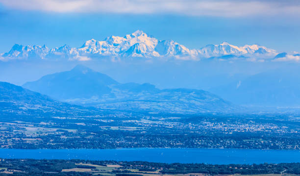 Mont Blanc and Leman Lake Image of snowcapped Mont Blanc Massif and Leman Lake seen from Jura Mountains in France. jura france stock pictures, royalty-free photos & images