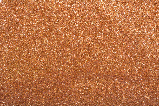 istock The texture of dry shiny glitter. Bronze bright sparkles 1274093960