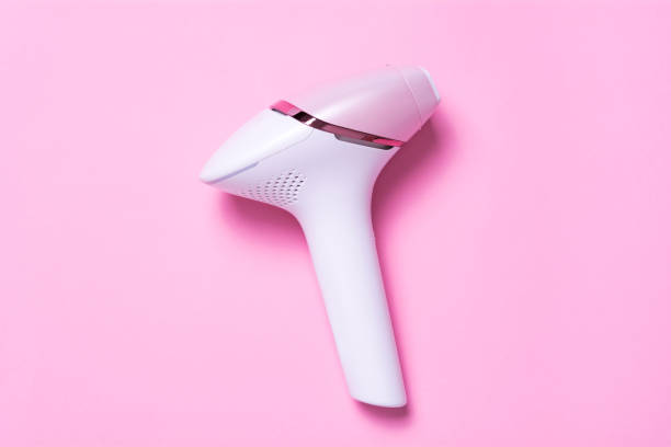 istock Photoepilator on a pink background. Hair removal tool 1274093971