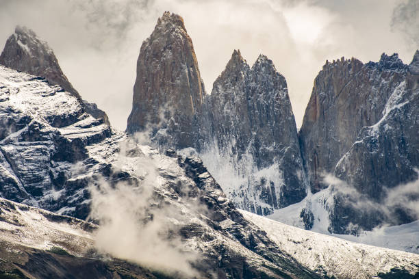 istock Torres del Paine peaks coming from clouds 1274094104