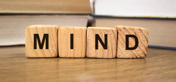 istock Mind words on wooden blocks with Books on blurred backround 1274094178