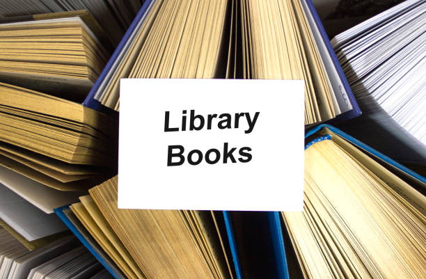 istock Library books written in white note on open books 1274094181