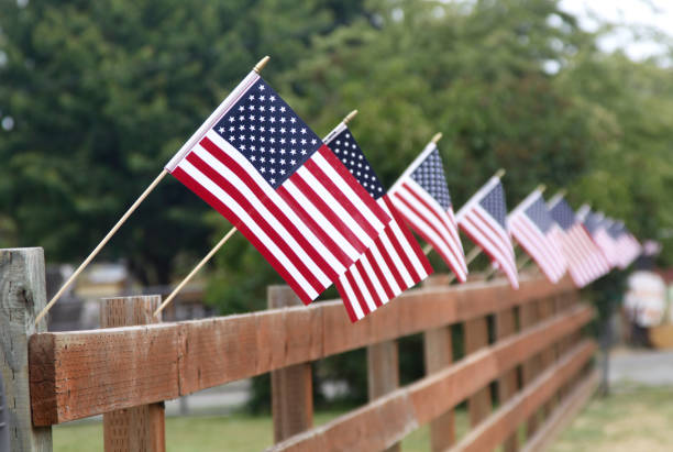 istock Row Of American Flags On A Fence 1274094253