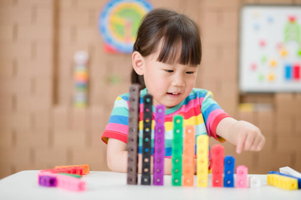 istock young girl play number sticks for home schooling 1274100992