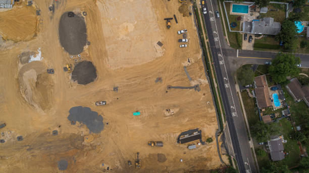 istock Construction site at the first stage of the earthwork in a small town. 1274127084